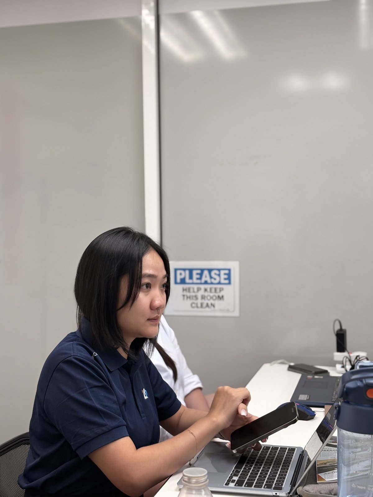 Team member following along on her laptop