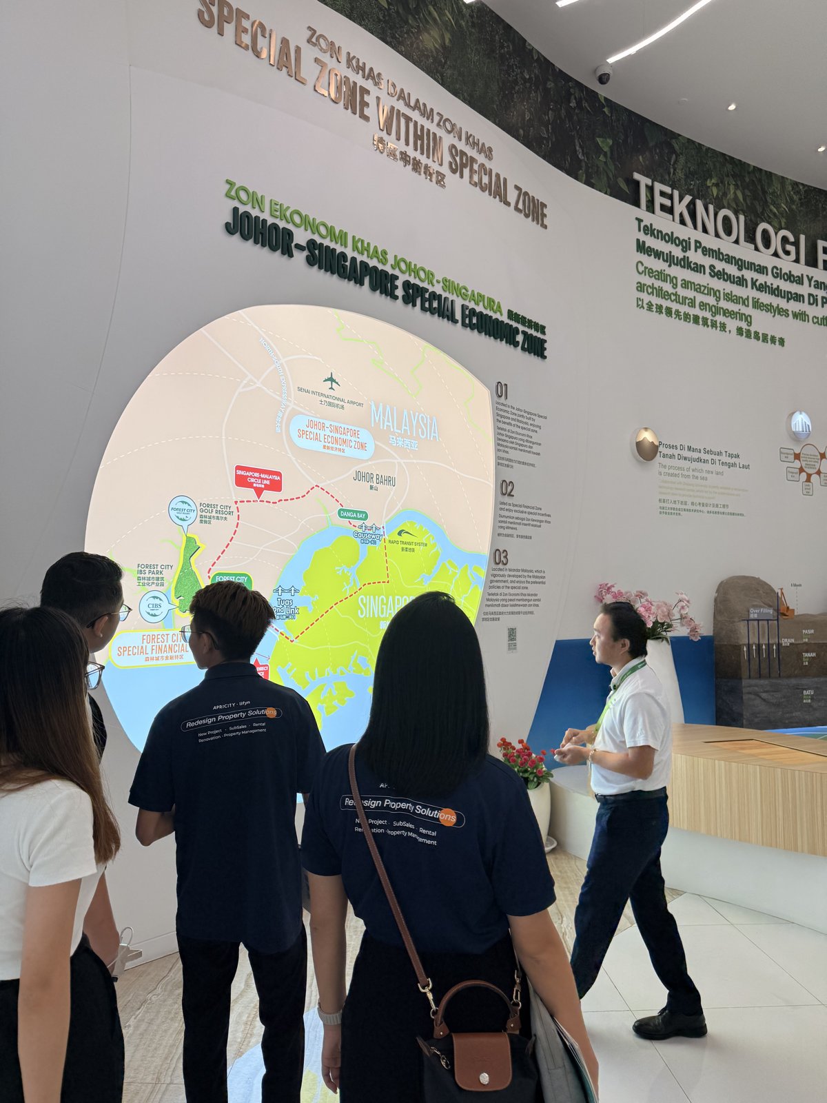 Team learning about the Johor–Singapore Special Economic Zone display