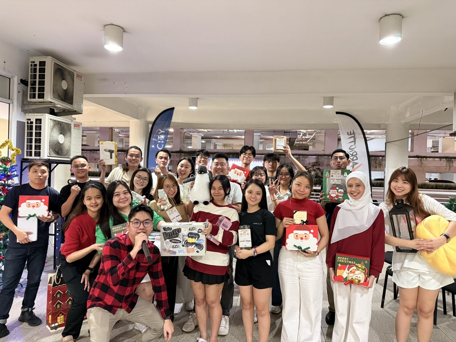 Apricity team group photo in festive outfits