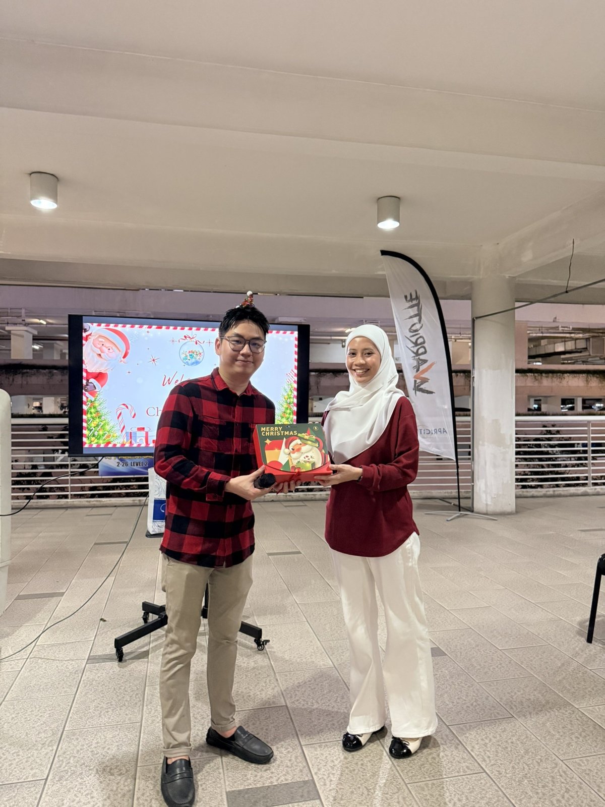 Colleagues exchanging Christmas gifts