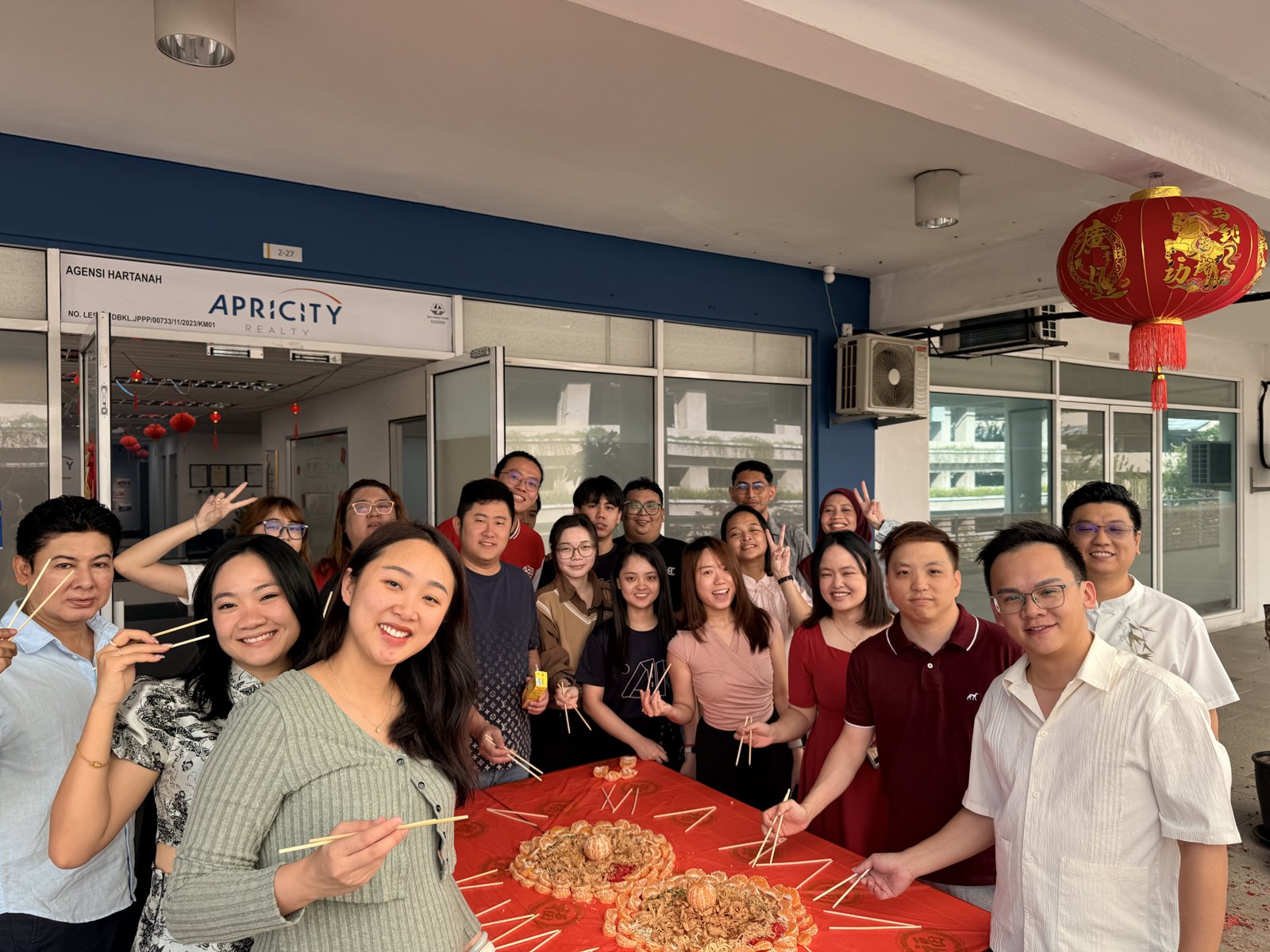 Team tossing yee sang at the KL office