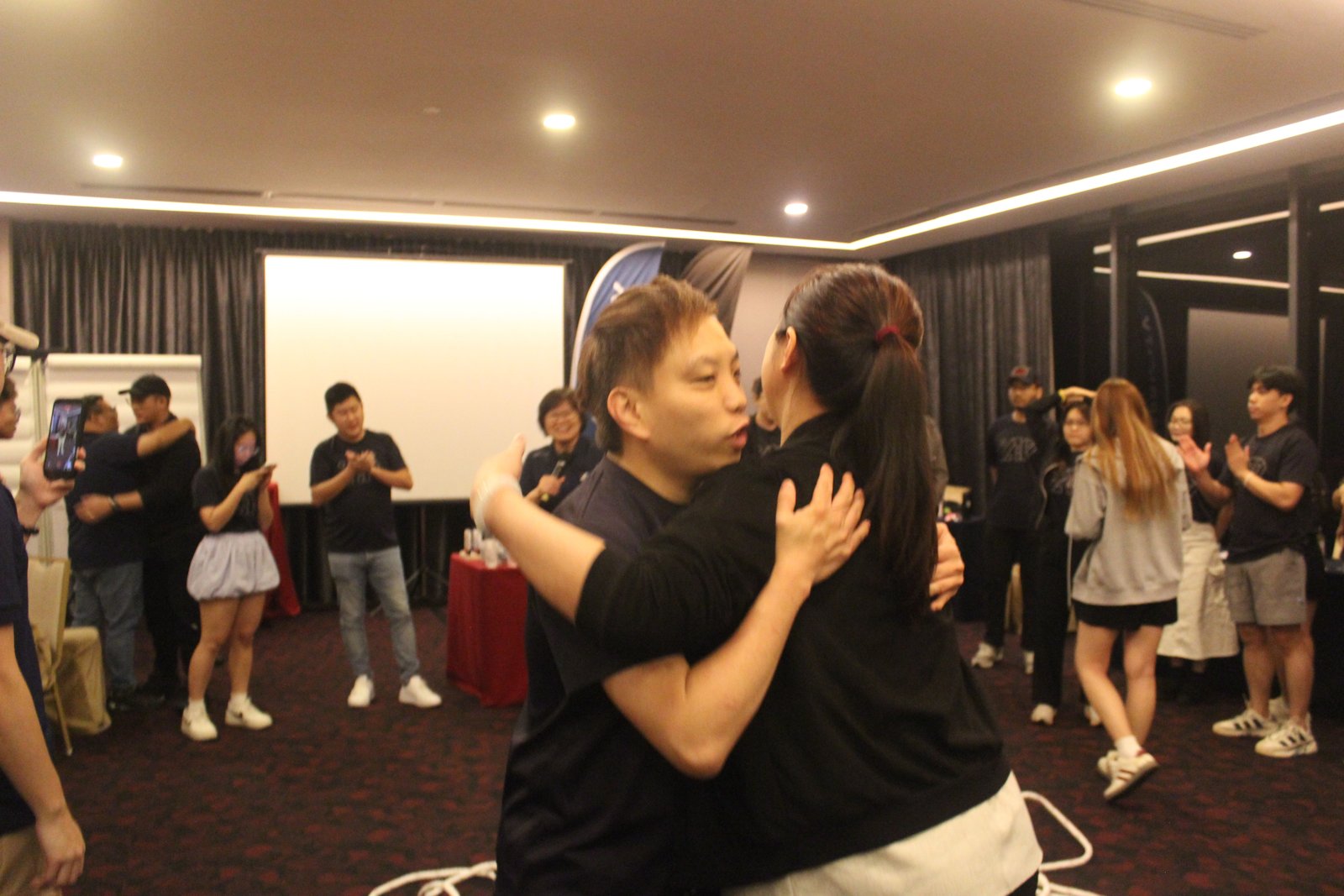 Teammates hugging during an activity