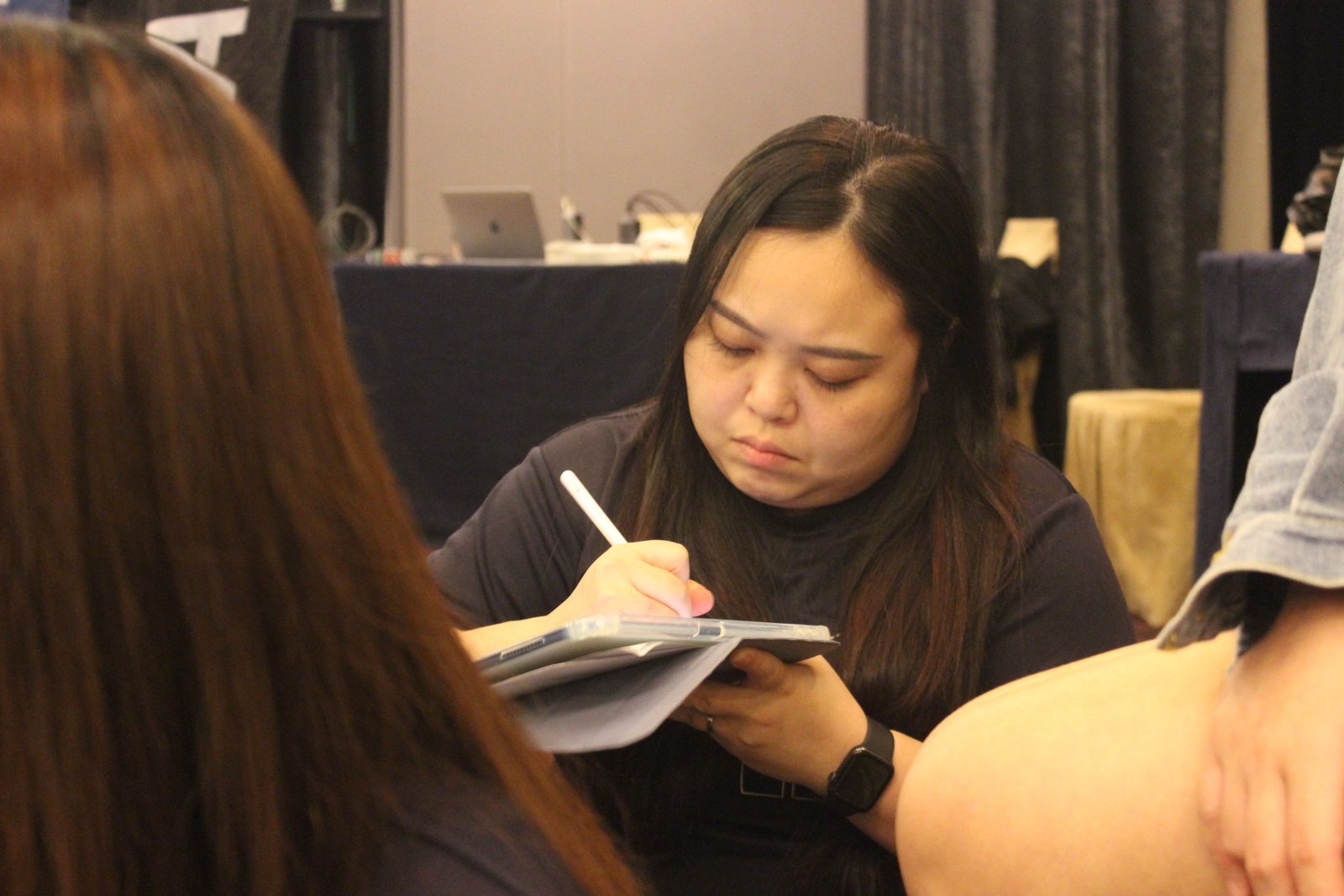 Team member taking notes during a challenge