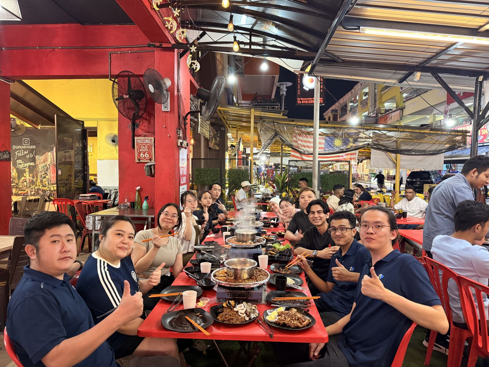 Team at a long BBQ dinner table