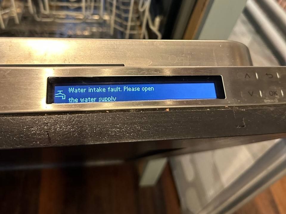 Miele dishwasher display showing water intake fault message