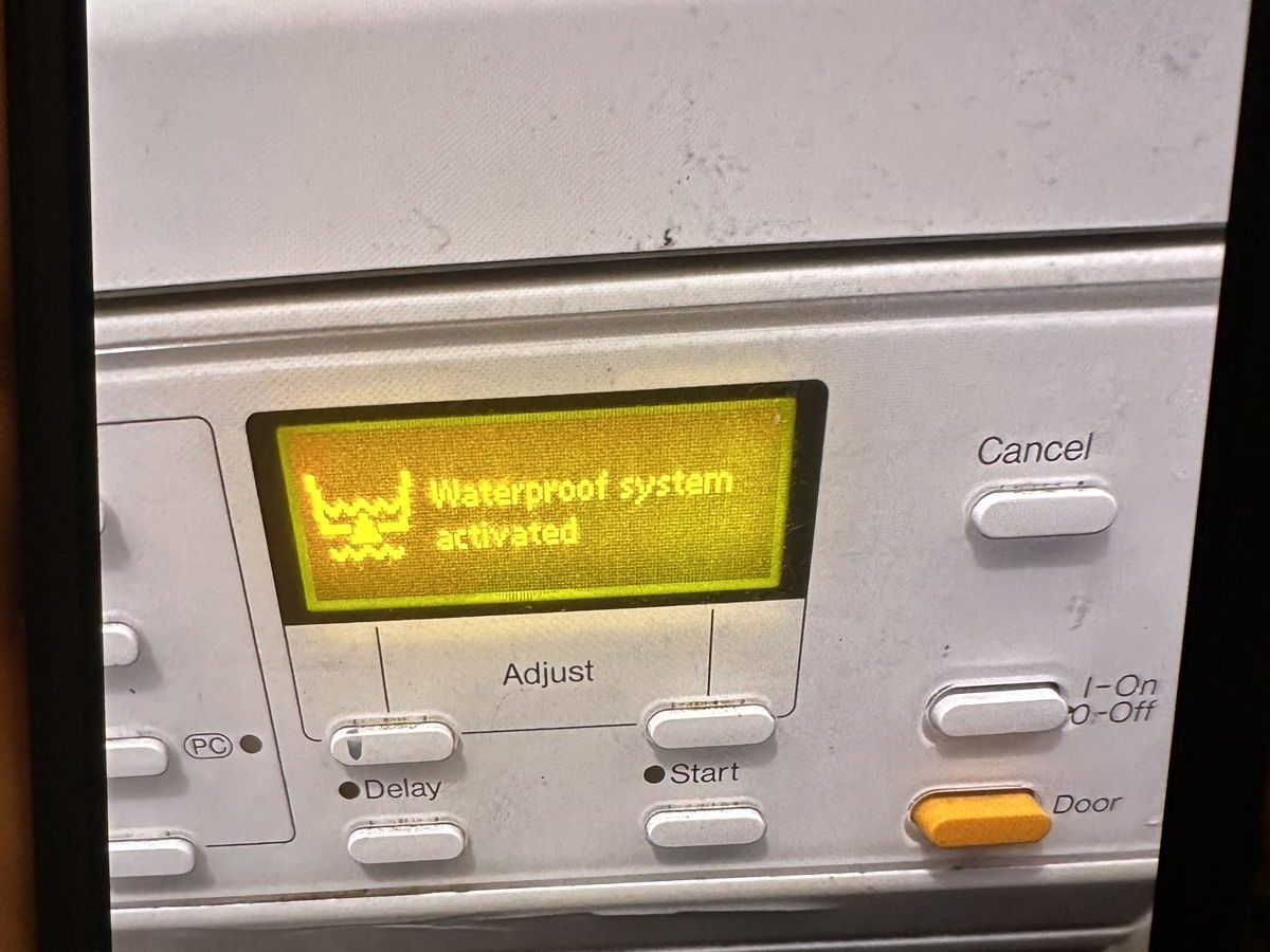 Miele washer display showing Waterproof system activated message
