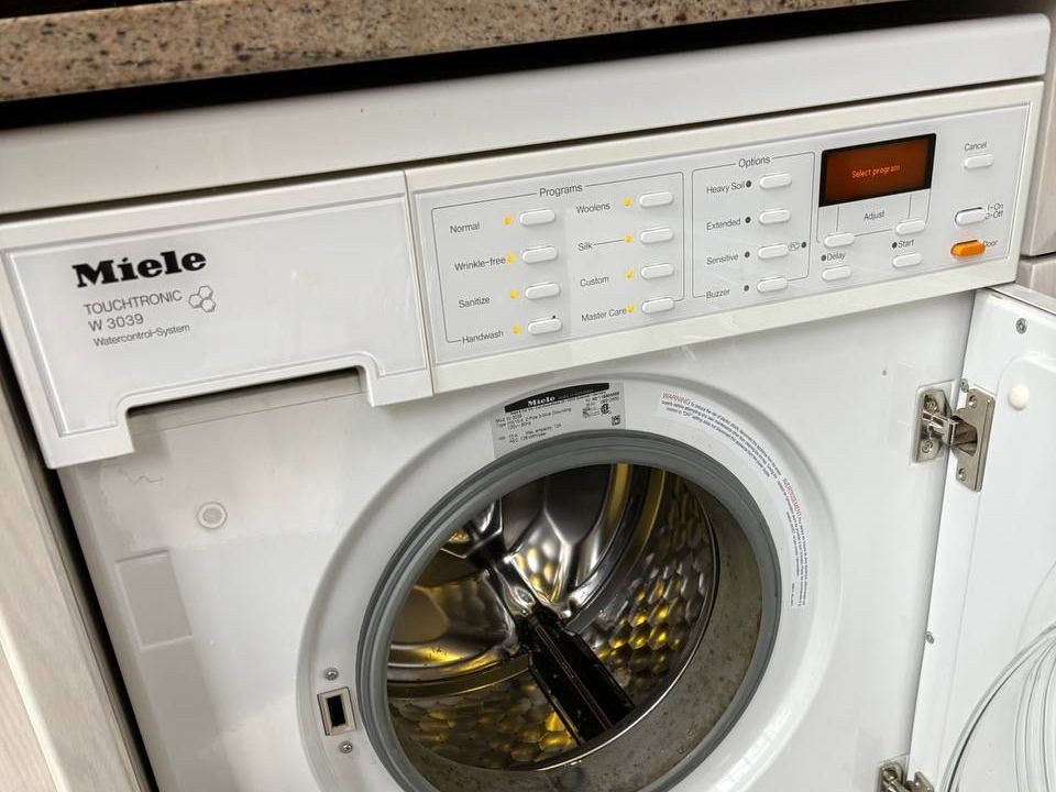 Built-in Miele washer in a New York apartment