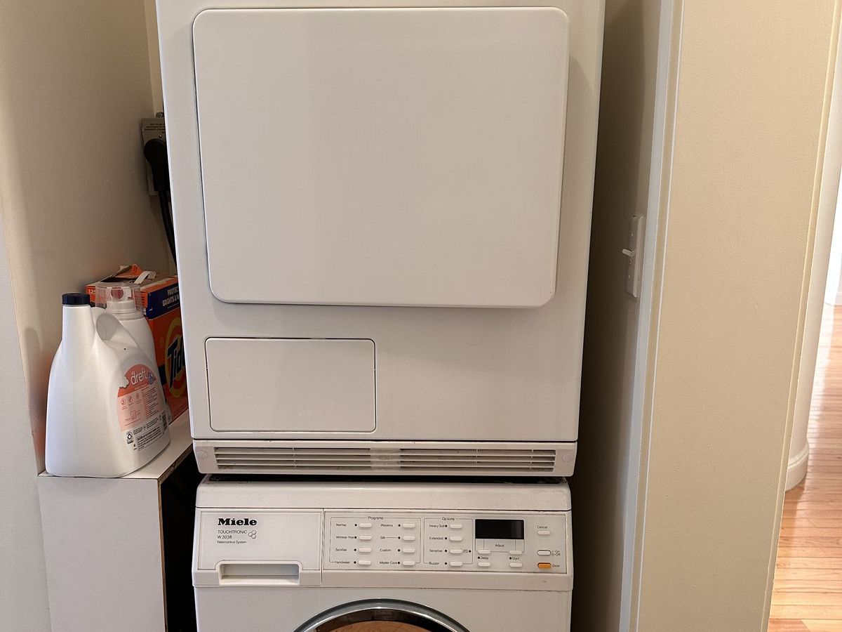 Stacked Miele dryer and washer pair in a NYC apartment