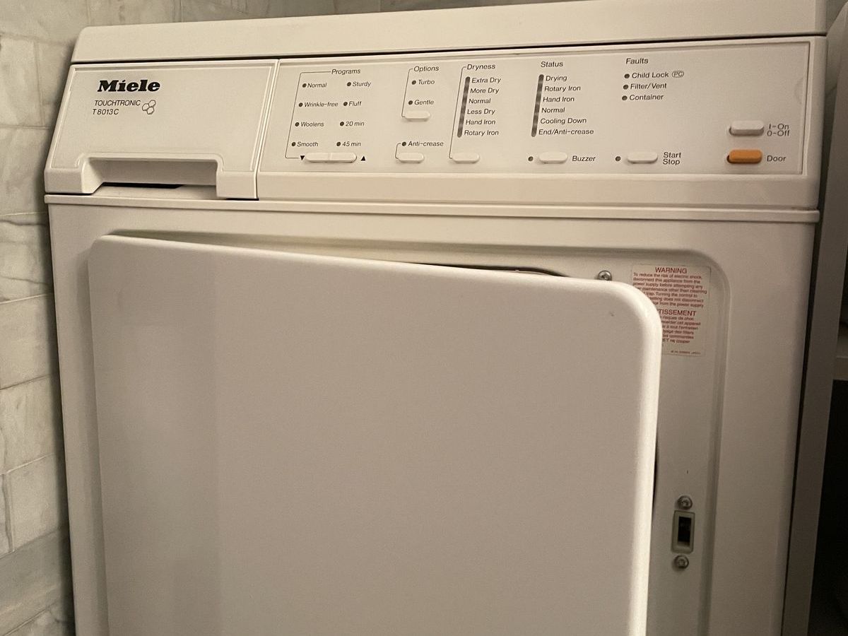 Miele T8013C condenser dryer installed in a NYC bathroom