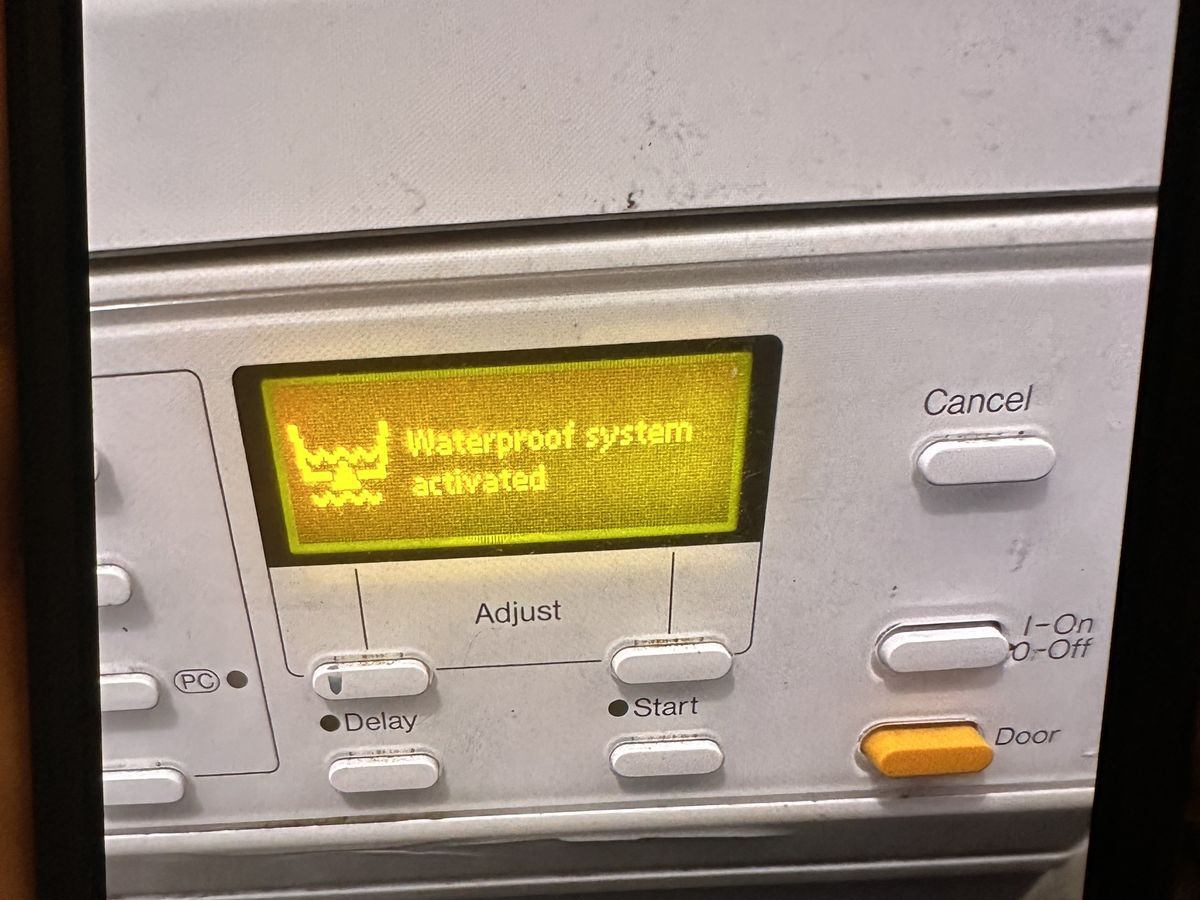 Miele washer display showing Waterproof System Activated message