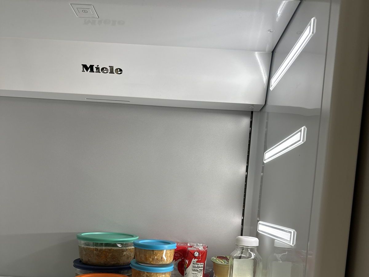 Miele logo inside a built-in refrigerator compartment