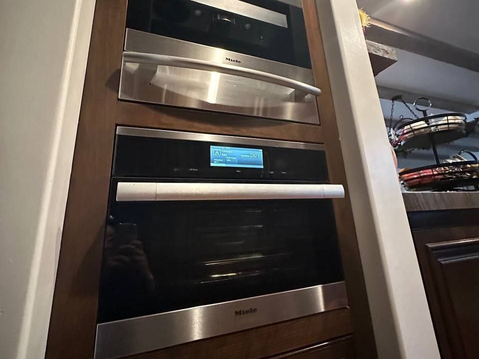 Miele combi oven display in a built-in column with warming drawer