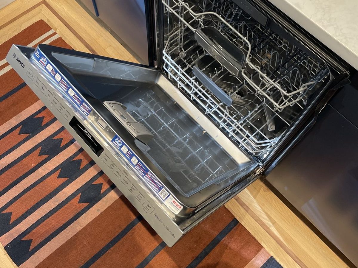 Open Bosch dishwasher during a drain pump service