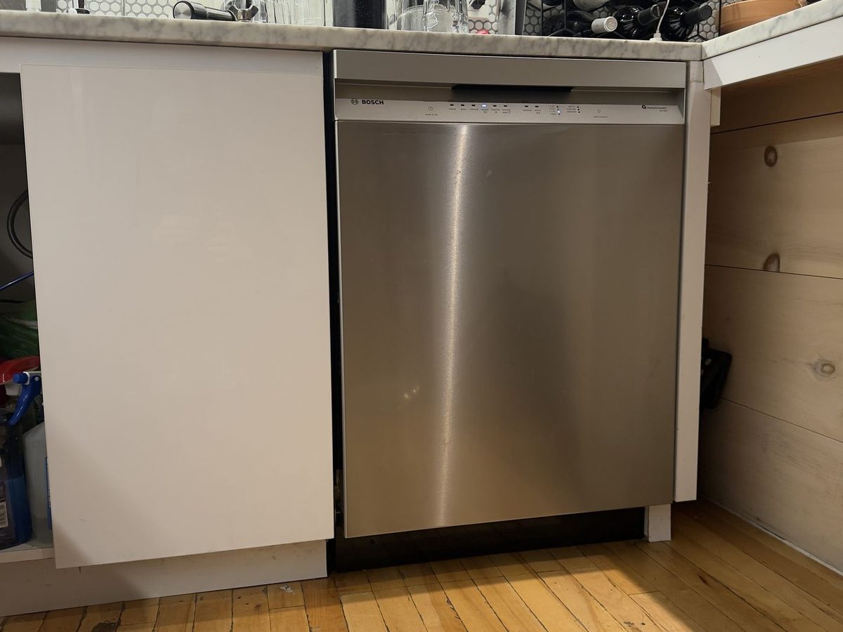 Bosch pocket-handle dishwasher under a stone countertop