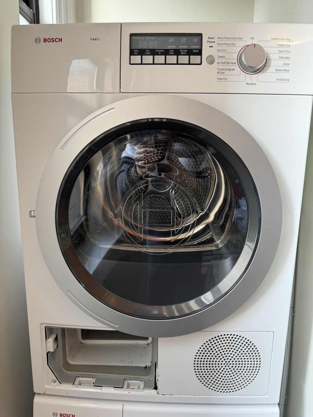 Bosch ventless condensation dryer with the door open in an NYC apartment