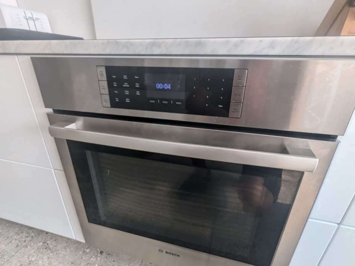 Built-in Bosch speed oven in a white kitchen