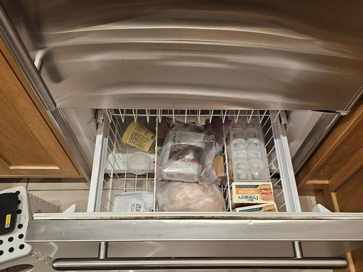 Sub-Zero built-in freezer drawer pulled open during a service visit