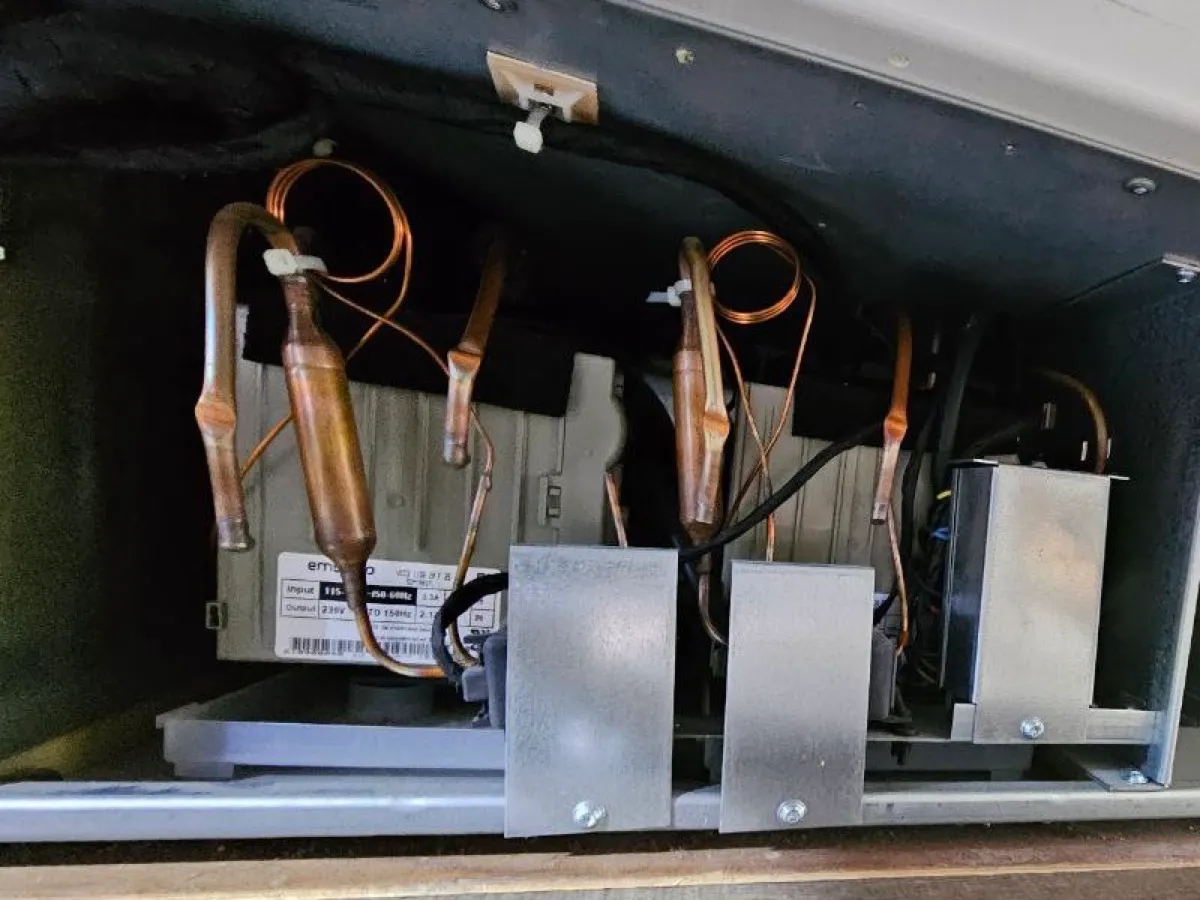 Compressor bay of a dual-compressor Thermador built-in refrigerator with inverters and copper lines