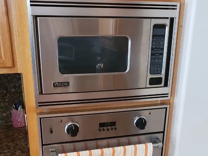 Viking wall oven and microwave stack built into cabinetry
