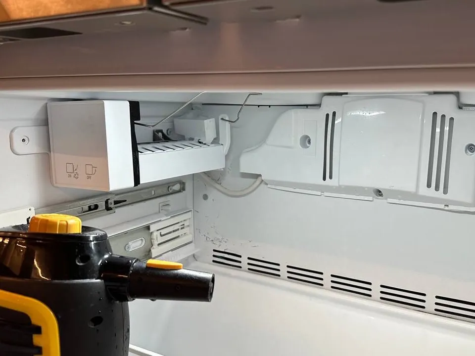 Ice maker inside a Viking freezer compartment during service