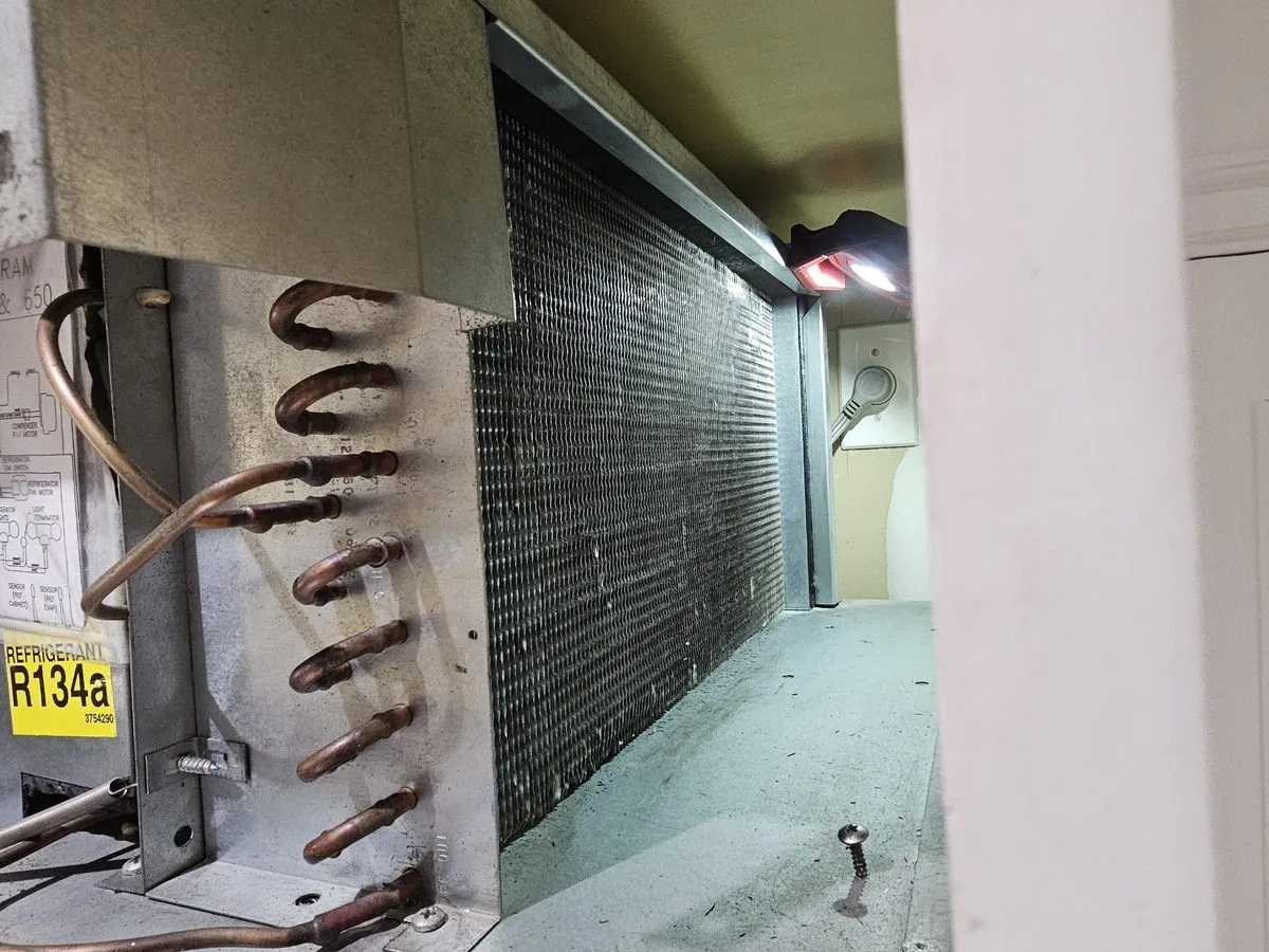 Walk-in cooler evaporator coil and refrigerant lines inside the box, NYC