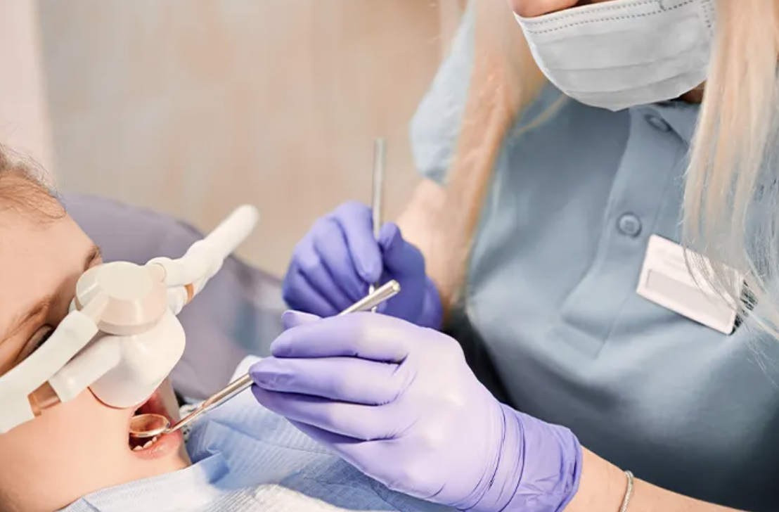 Child receiving dental sedation with nasal mask at Coastal Virginia Oral Surgery.