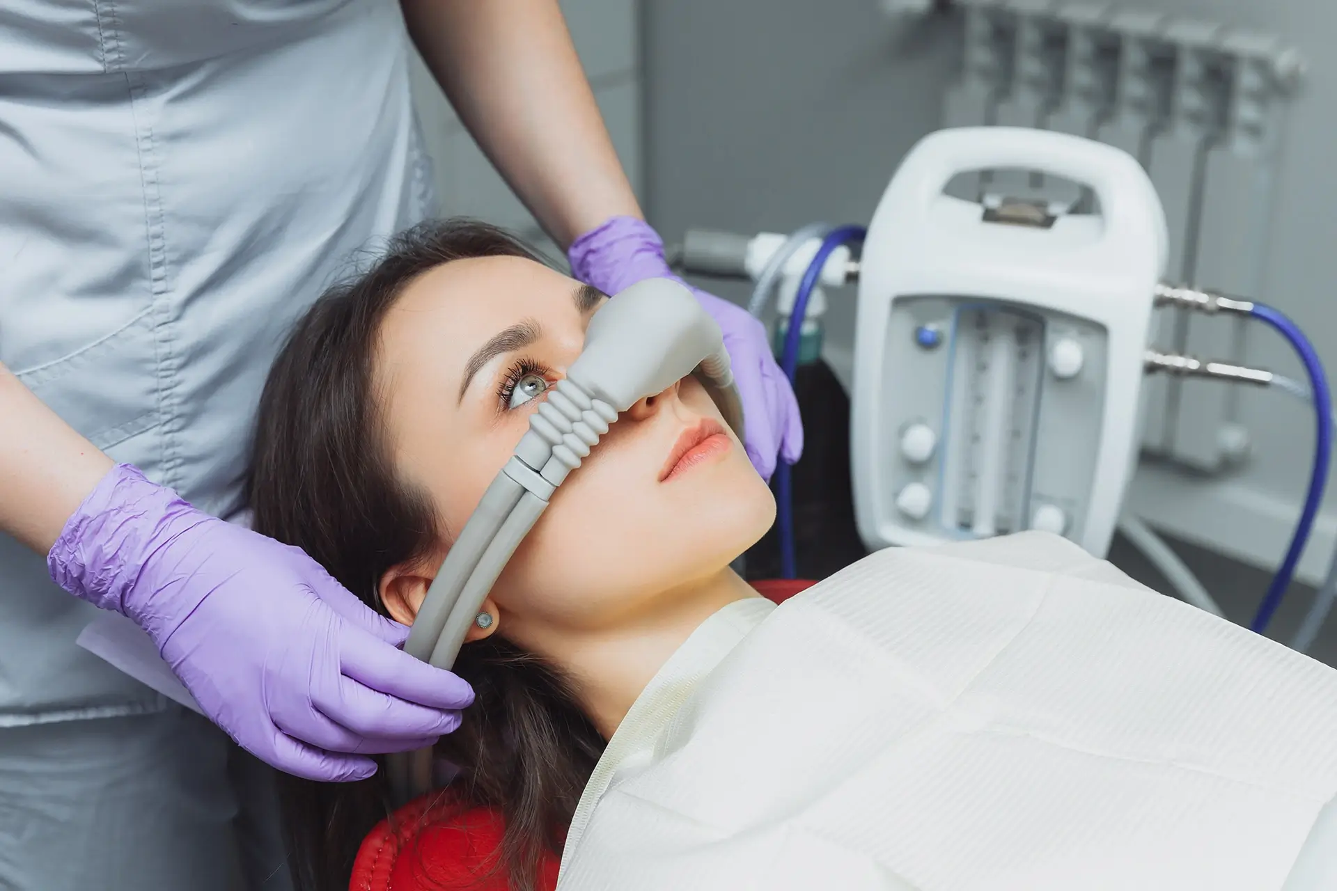 Patient receiving nitrous oxide sedation via a nasal mask.