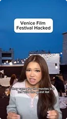 Female news presenter reporting about the Venice Film Festival being hacked, with a nighttime cityscape in the background.