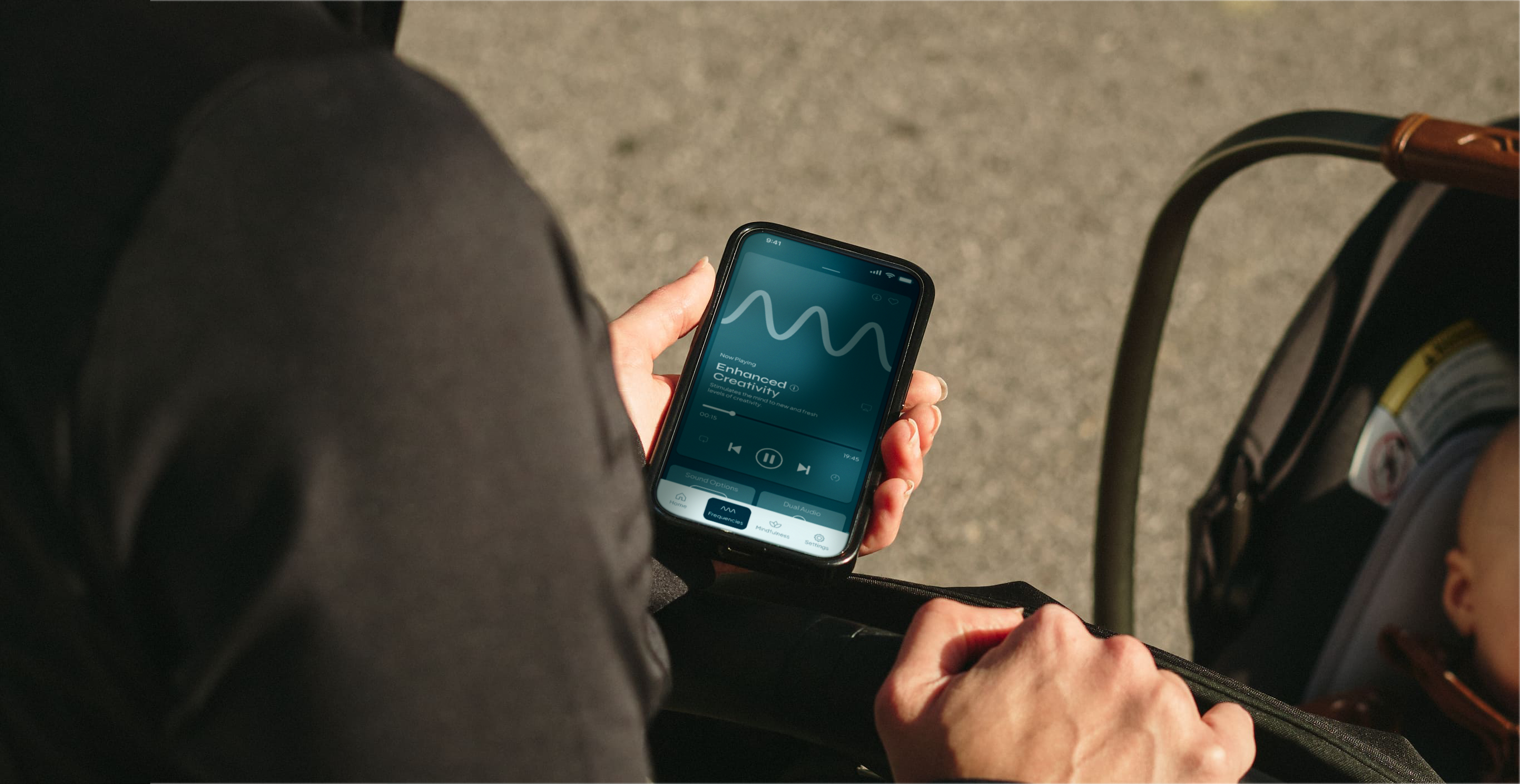 Close-up of a play icon on a device showing a sound frequency waveform.