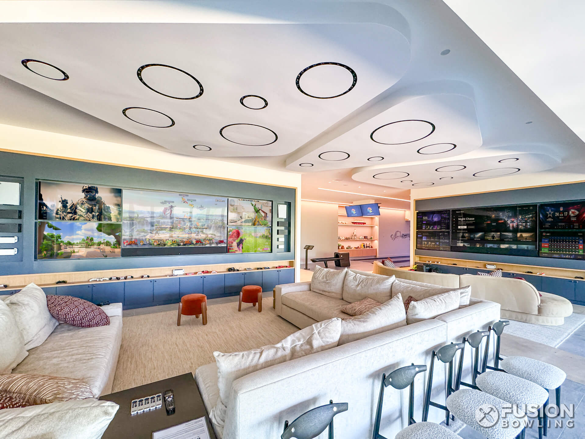 Virginia custom home with video game wall next to bowling alley.