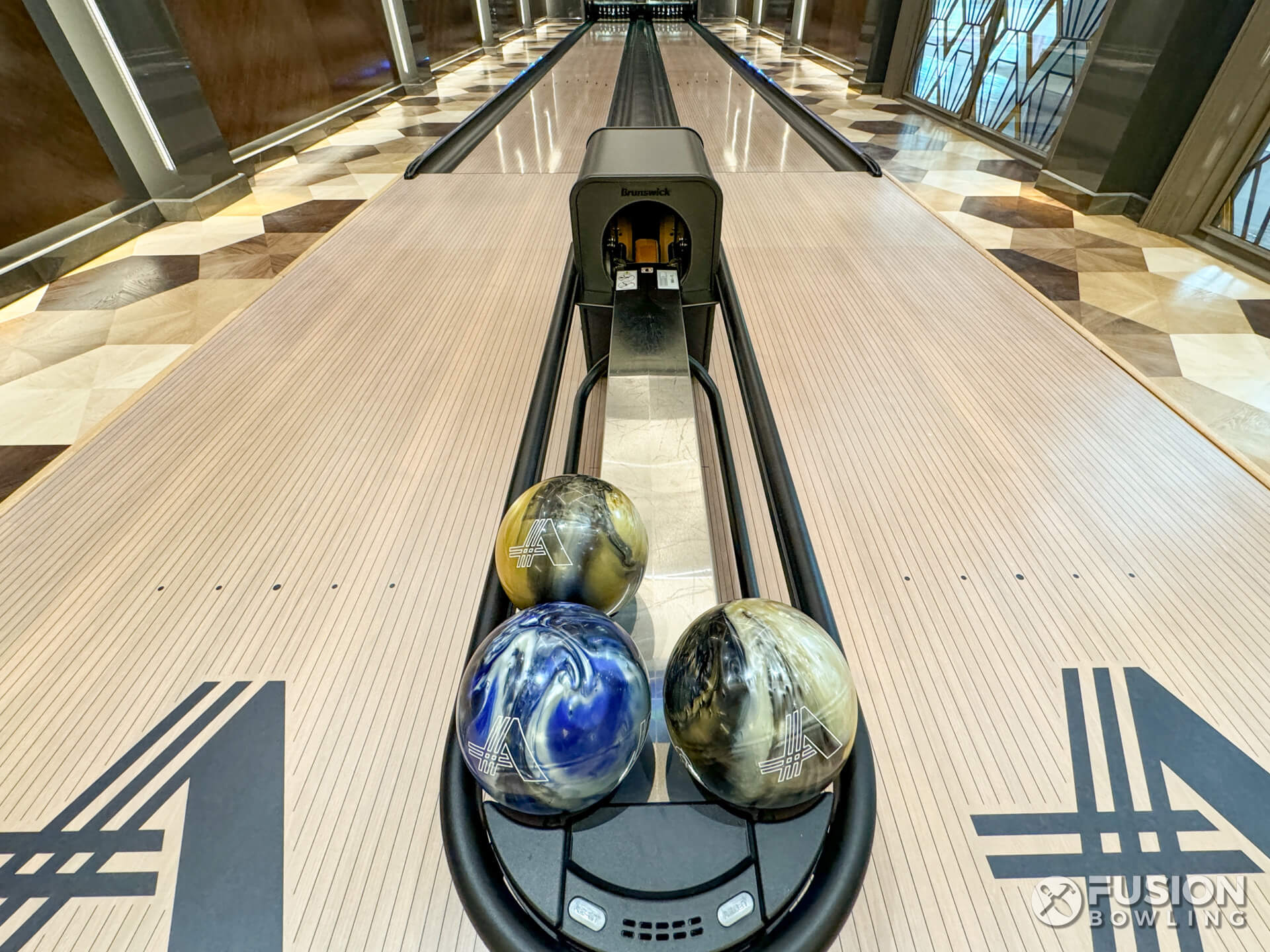 Custom bowling balls and custom approach monogram logo in a private bowling alley.