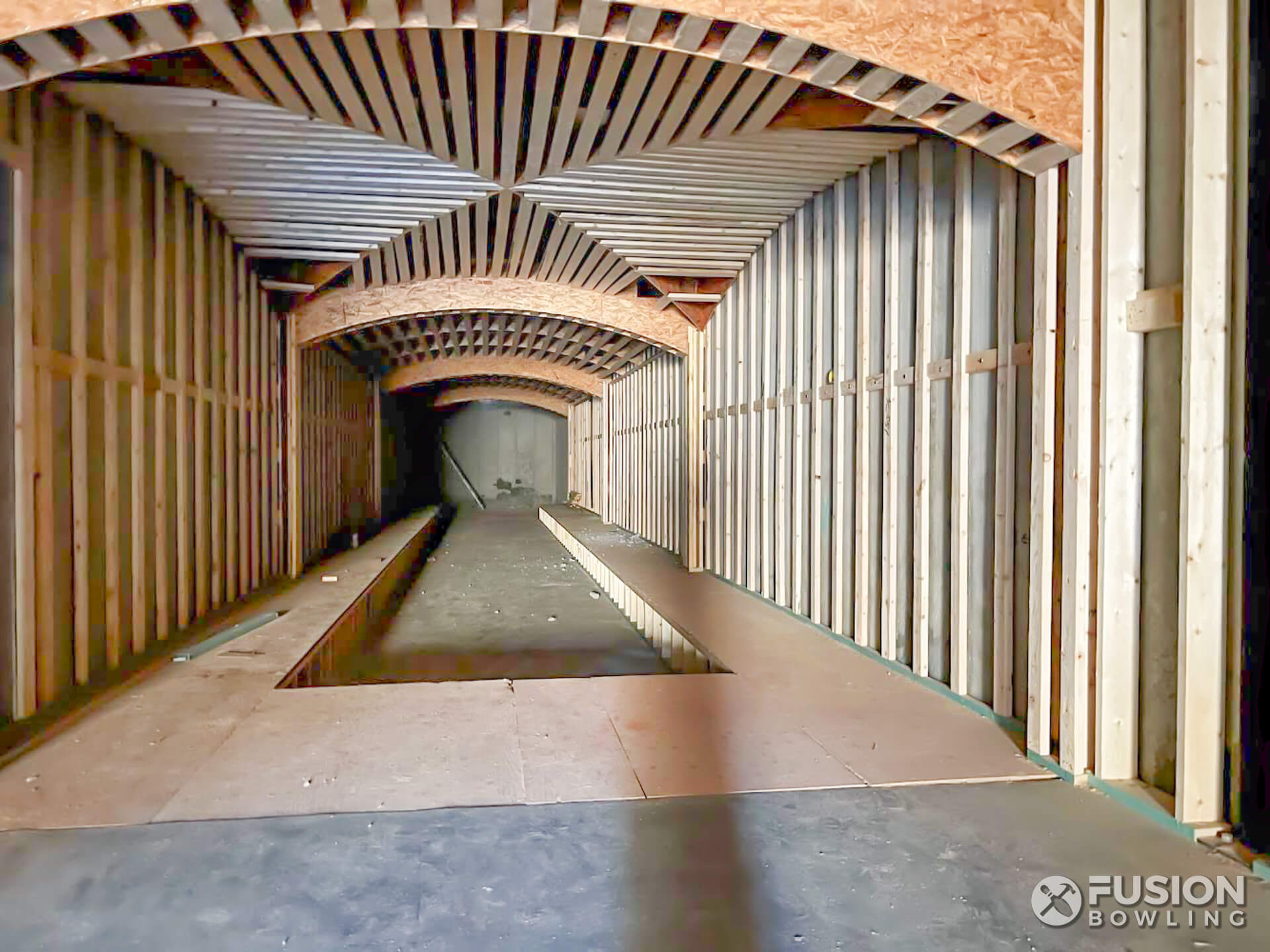 Rough framing for long room with ceiling arches.