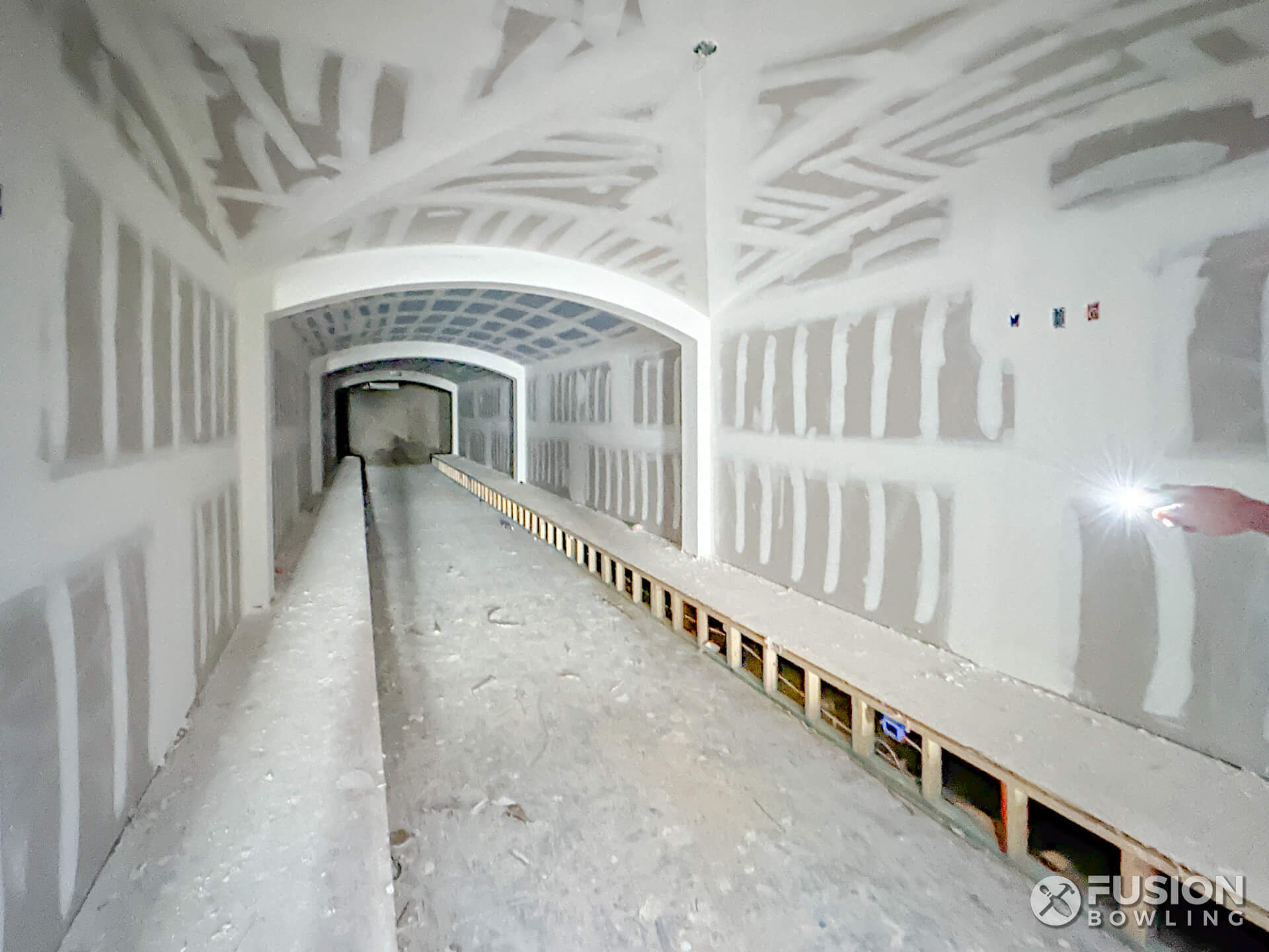Home bowling lane room under construction with floor recession before the bowling alley is installed.