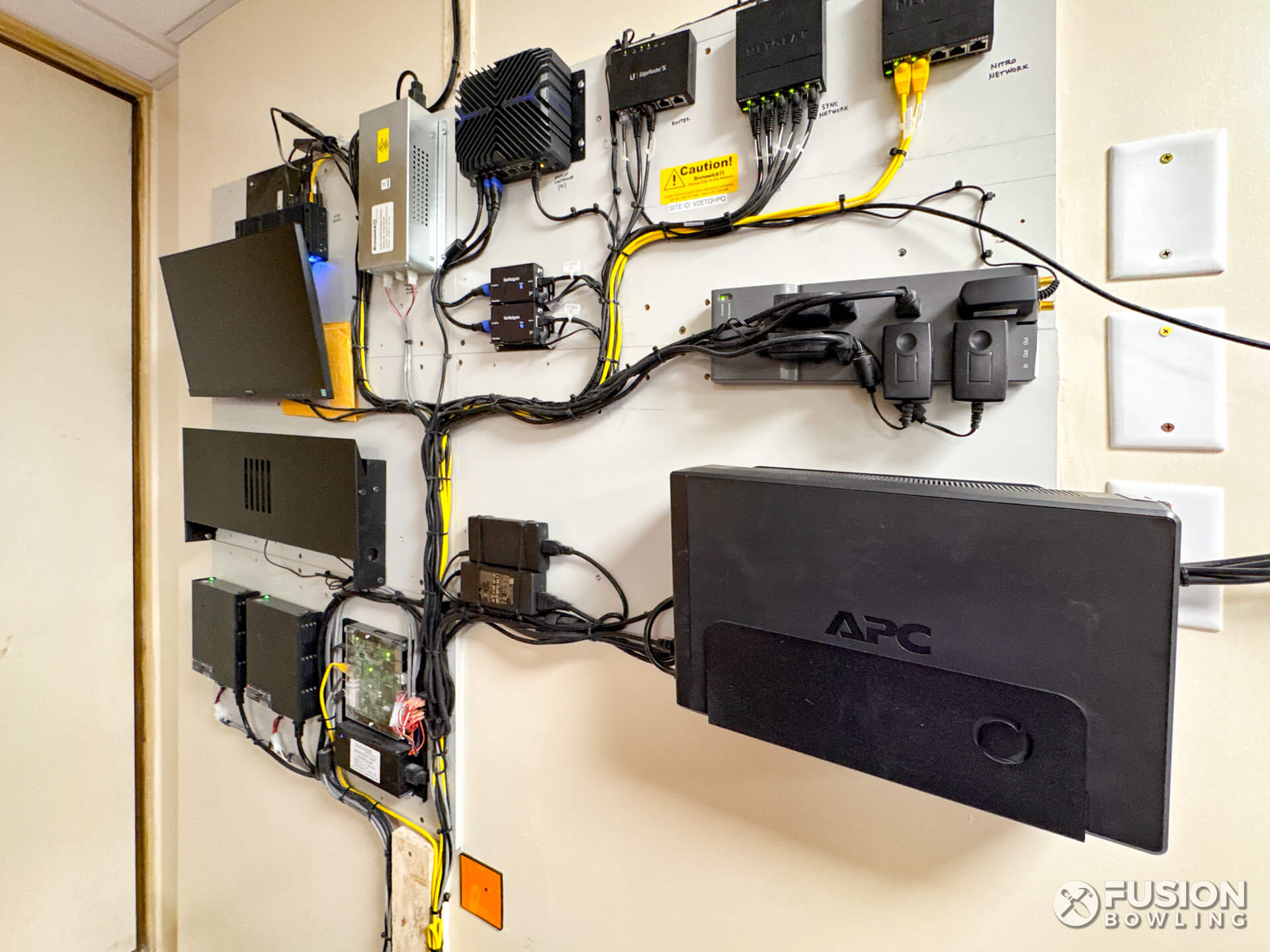 Wall-mounted electronics board for a 2-lane residential bowling alley mechanical room.
