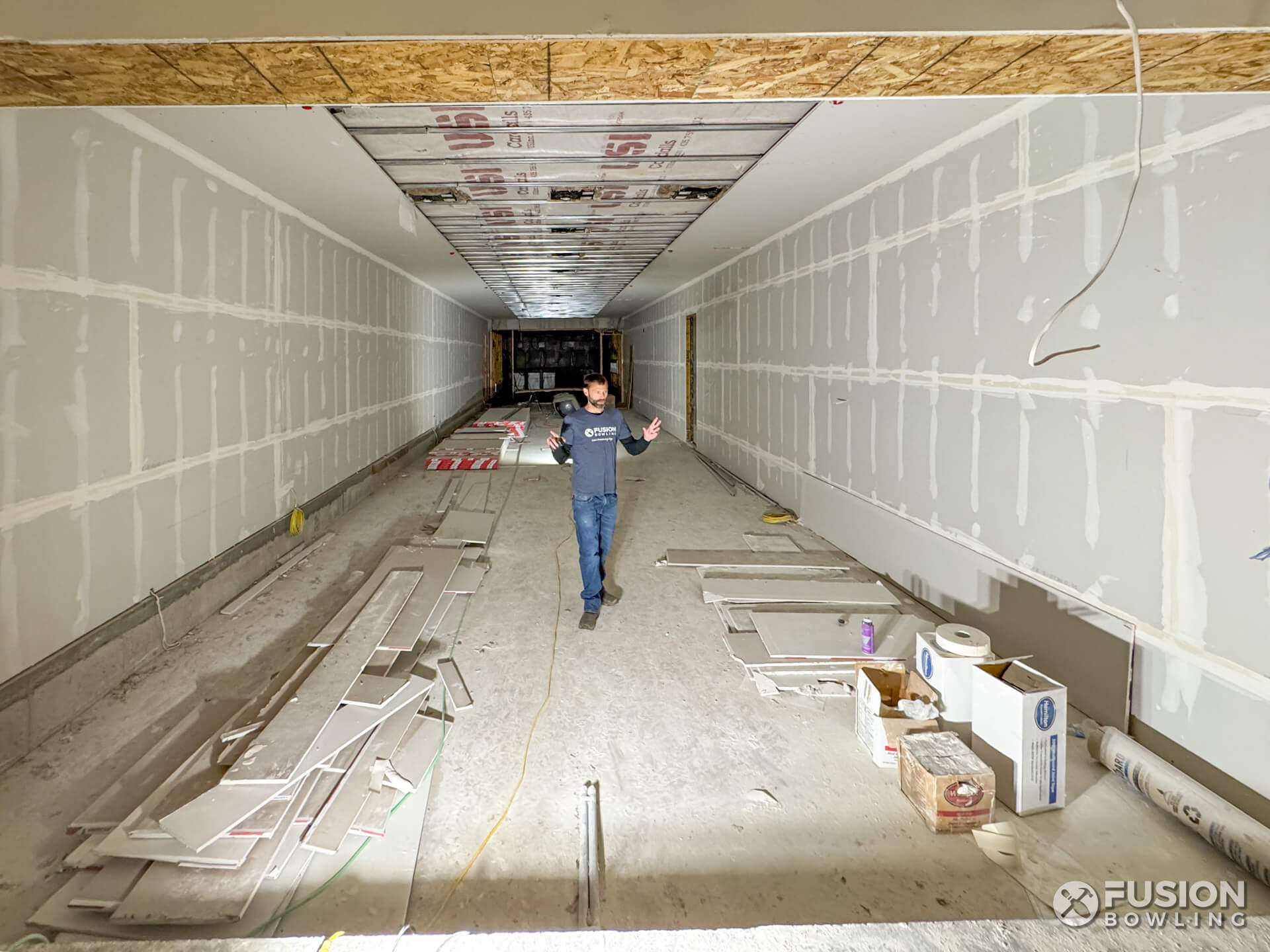 Residential bowling alley room under construction with recessed slab depression in Utah.