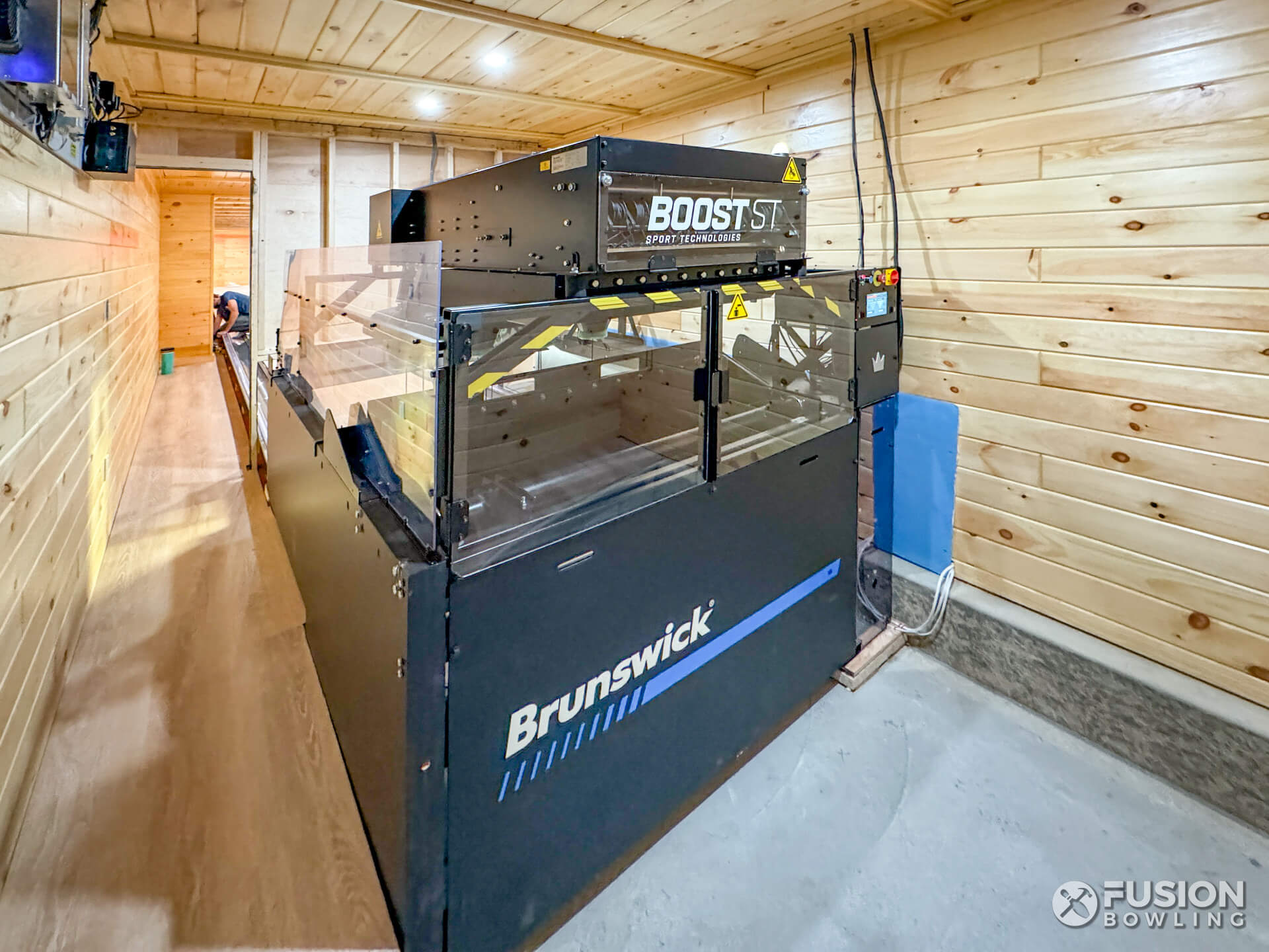 Brunswick Boost pinsetter machine by itself in a home.