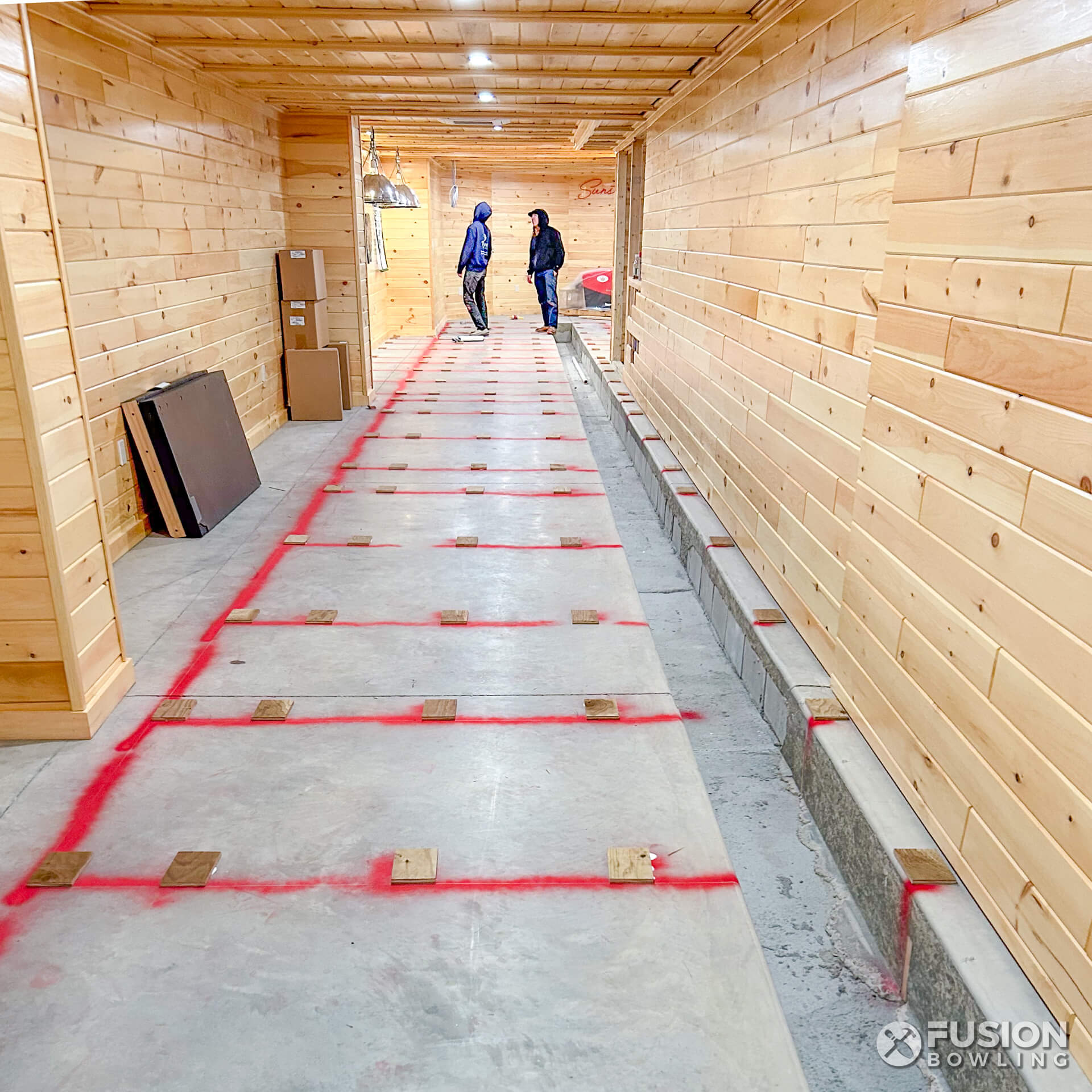 Fusion Bowling's bowling alley installers building a home bowling lane.