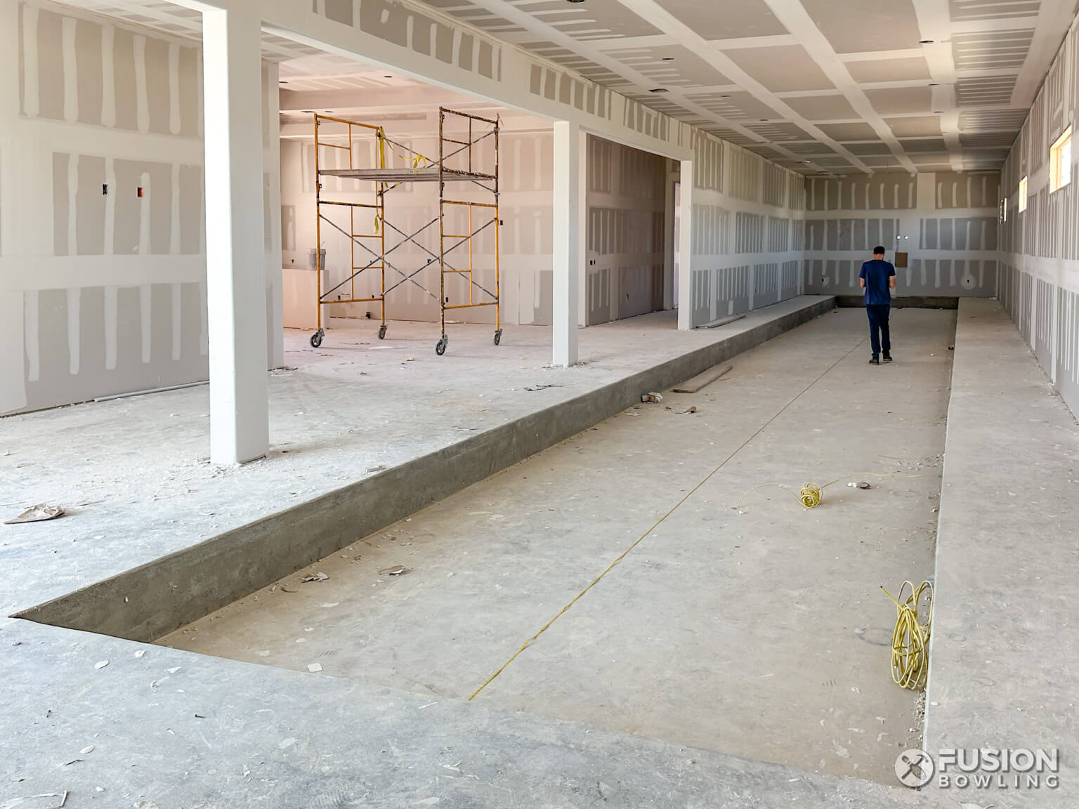 Recessed concrete for home bowling alley with slab depression.