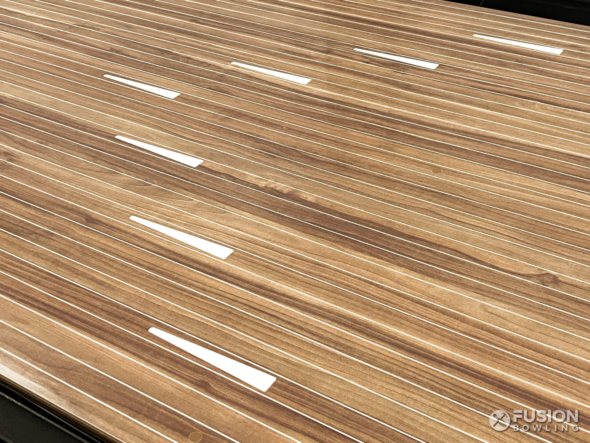 Macchiato bowling lane color with white arrows and board lines.