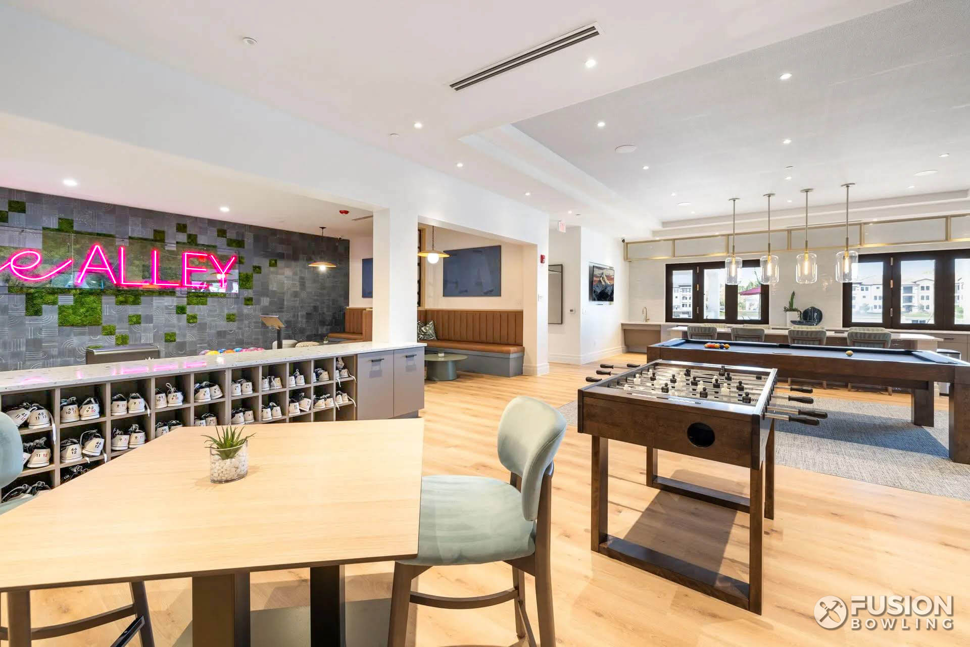 Multifamily lounge cafe seating with cubby holes for bowling shoes.