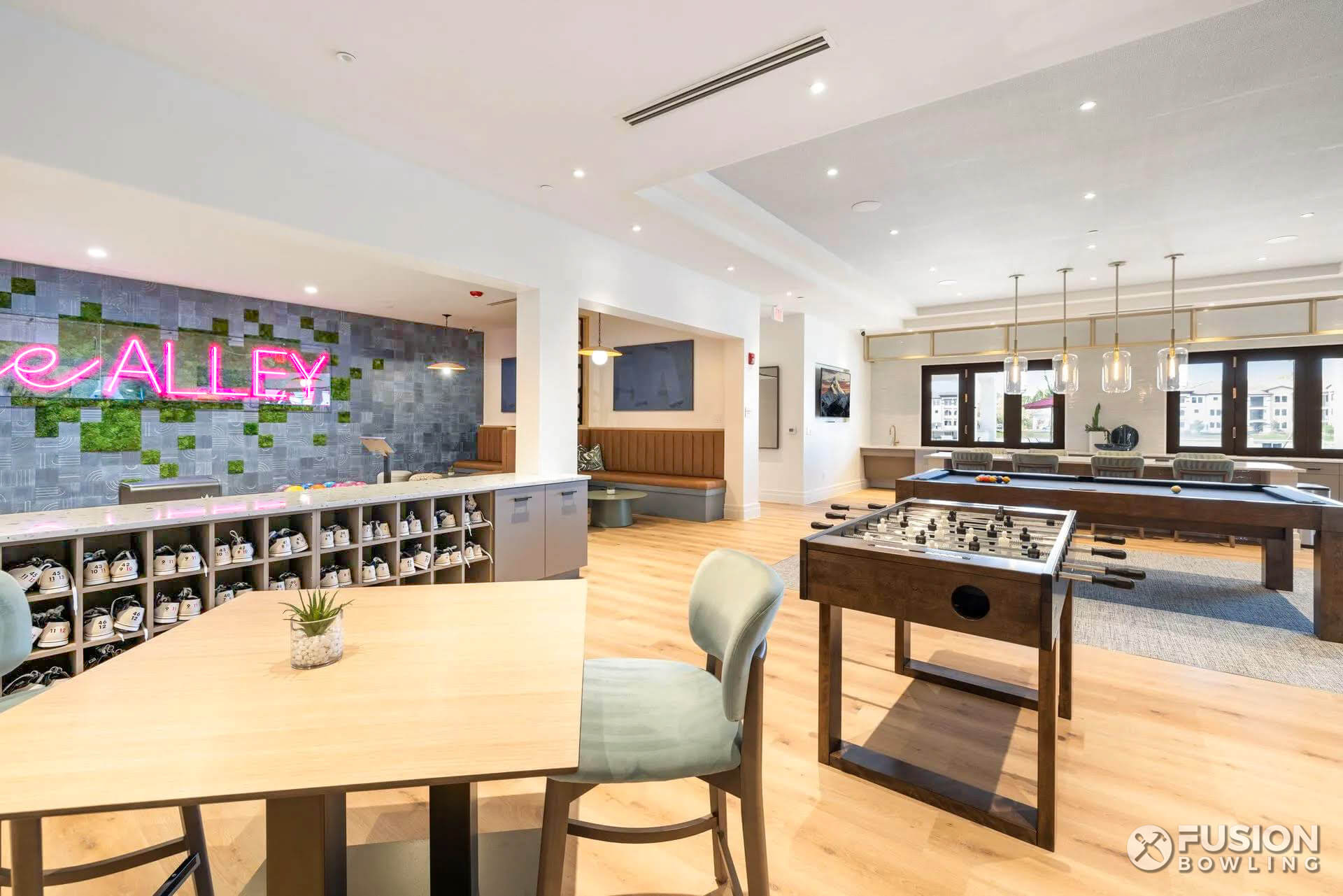 Multifamily lounge cafe seating with cubby holes for bowling shoes.