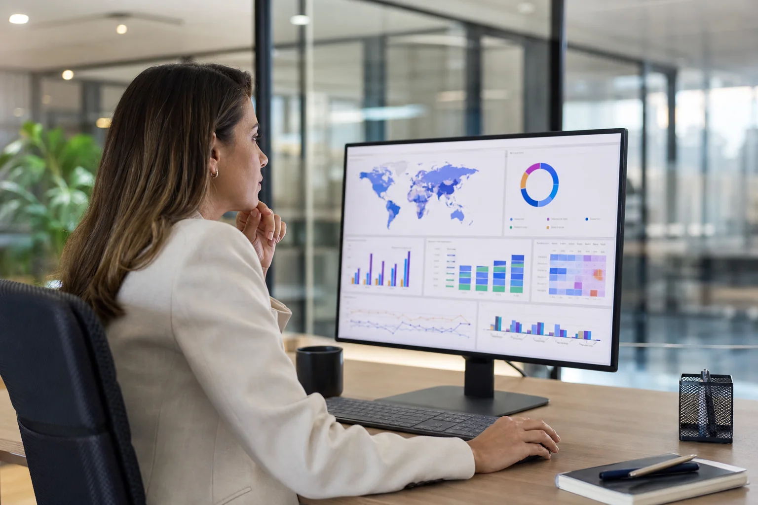 HR leader reviewing a consolidated recruitment dashboard showing vendor performance data across multiple countries