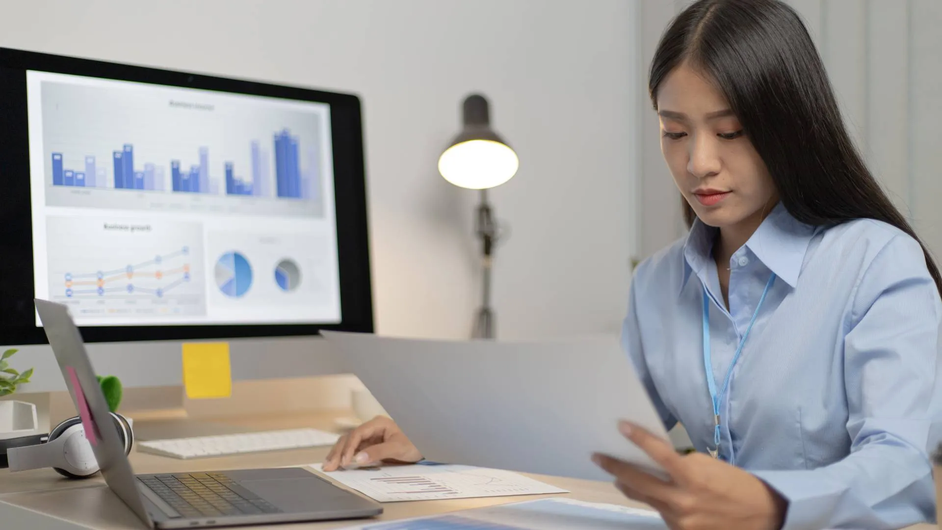 A woman sitting at a desk working.