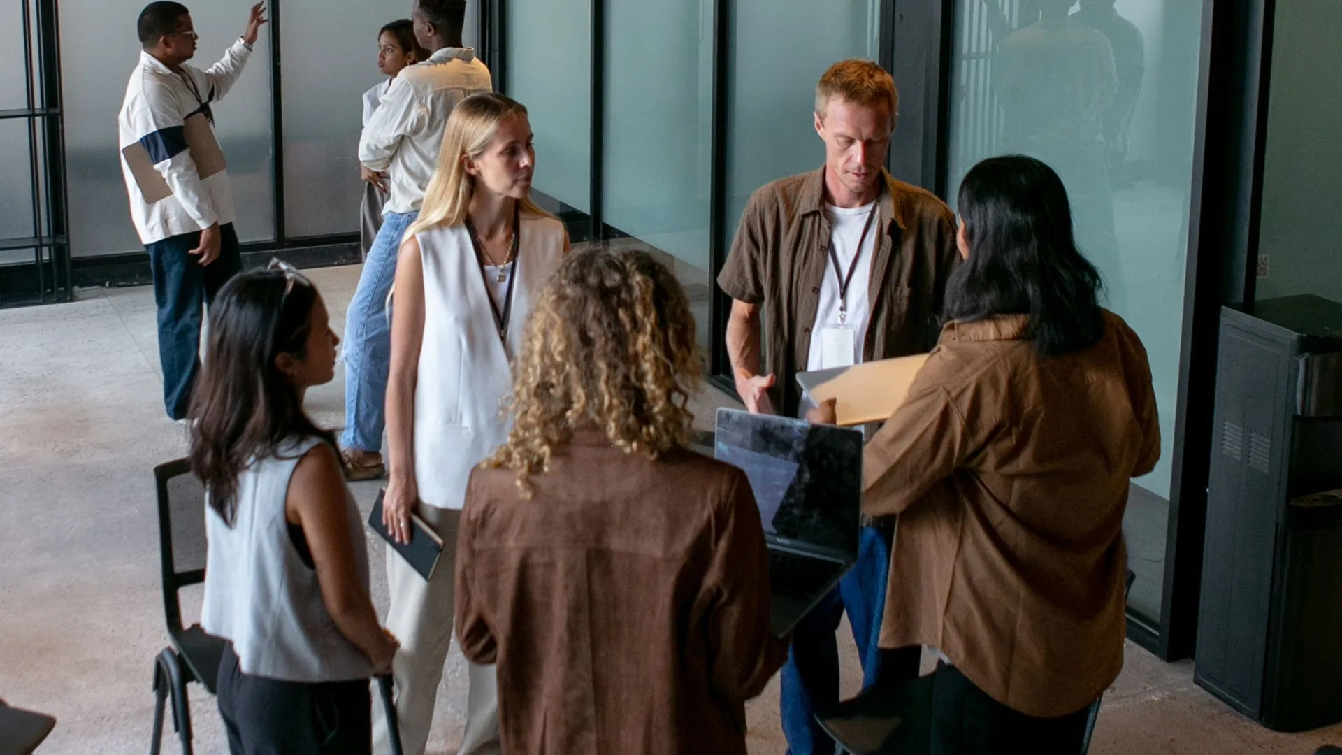 A group of people are participating in an experiential learning exercise in their office.