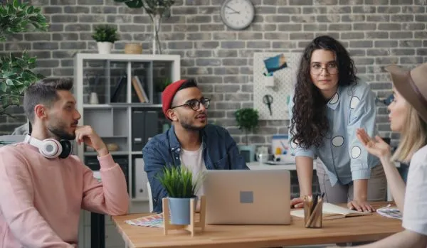 A team is working together on a project in an office.
