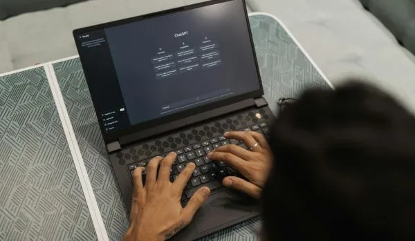 We're looking over the shoulder of someone using chatgpt on their laptop.