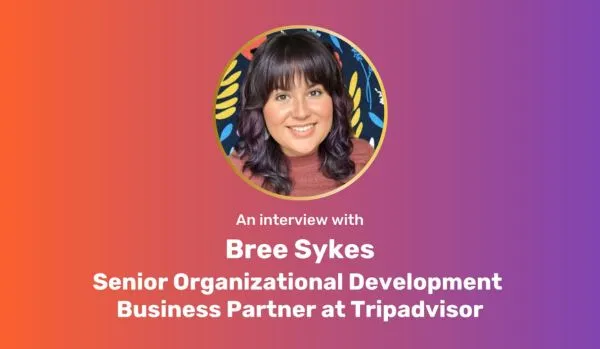 A purple-orange gradient rectangle with a circle image of Bree Sykes centered at top. Under the photo is white centered text: "An interview with Bree Sykes Senior Organizational Development Business Partner at Tripadvisor"