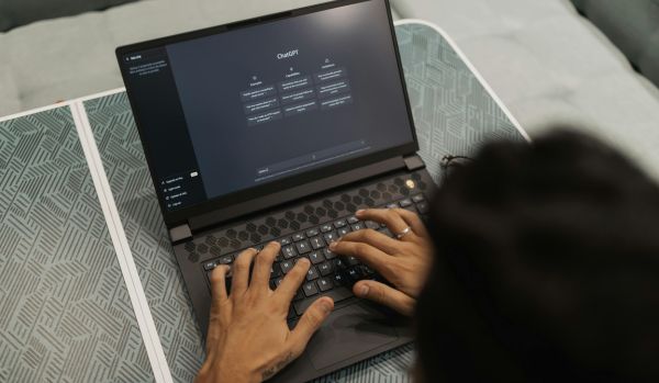 We're looking over the shoulder of someone using chatgpt on their laptop.