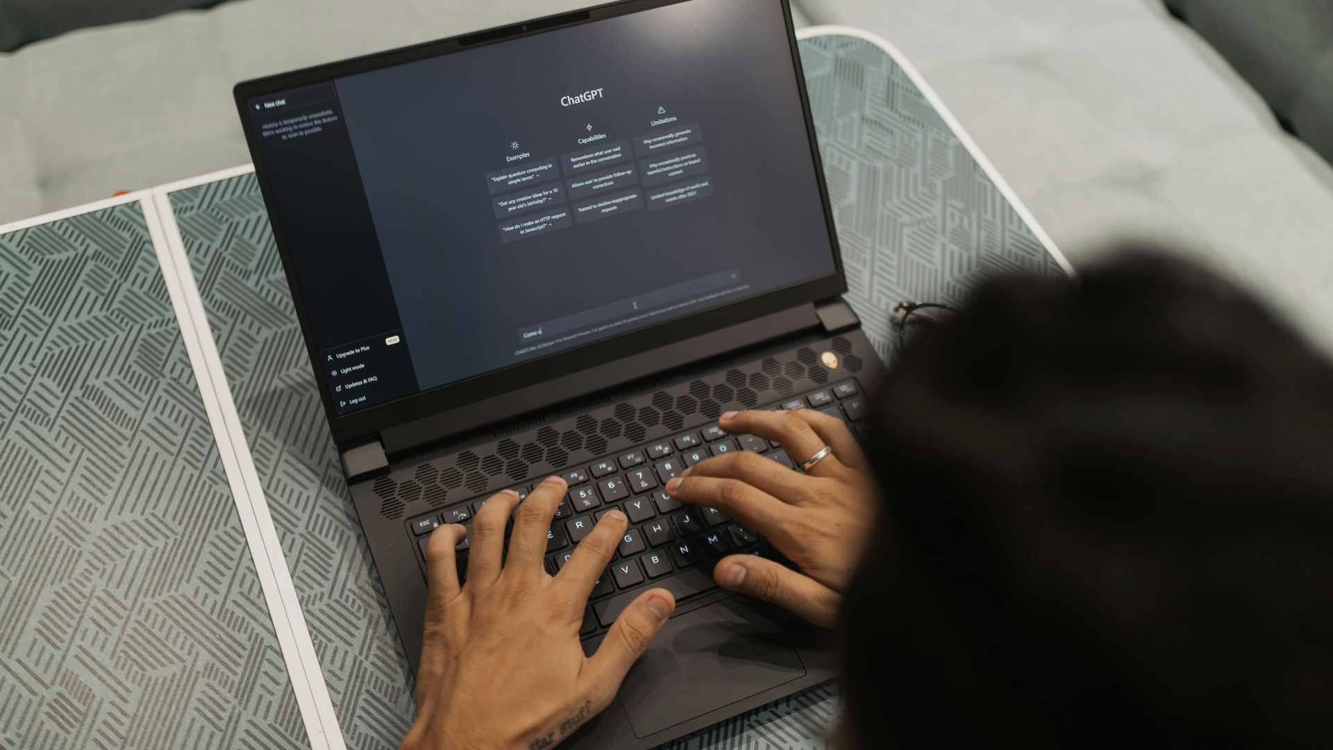 We're looking over the shoulder of someone using chatgpt on their laptop.