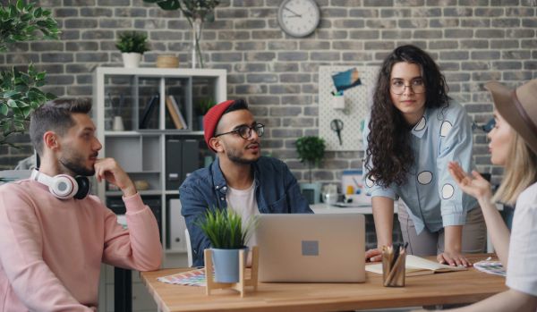 A team is working together on a project in an office.